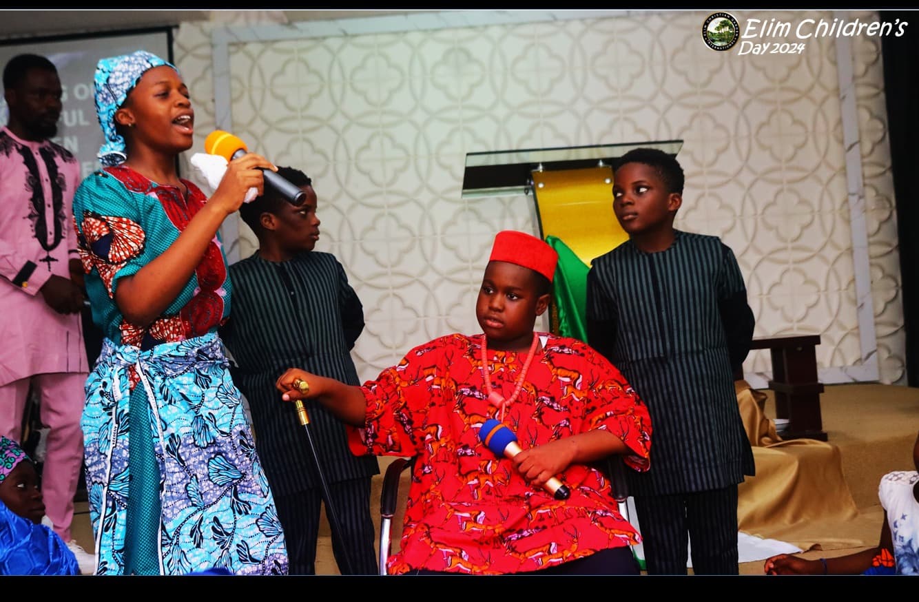 Children taking part in a celebration at Elim